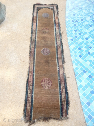 beautiful early tibetan monastic bench cover fragment with floating guls on an empty brown space. lovely patinated old colors, the black color in places is a natural brown overdyed with dark indigo.super  ...