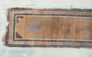 beautiful early tibetan monastic bench cover fragment with floating guls on an empty brown space. lovely patinated old colors, the black color in places is a natural brown overdyed with dark indigo.super  ...