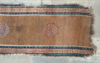 beautiful early tibetan monastic bench cover fragment with floating guls on an empty brown space. lovely patinated old colors, the black color in places is a natural brown overdyed with dark indigo.super  ...