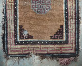 beautiful early tibetan monastic bench cover fragment with floating guls on an empty brown space. lovely patinated old colors, the black color in places is a natural brown overdyed with dark indigo.super  ...