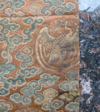 tiny fragment great charisma! silk brocade fragment from the late ming era with crane roundel. strong  imagery refering to long life and immortality according to the daoistic tradition, one row of  ...