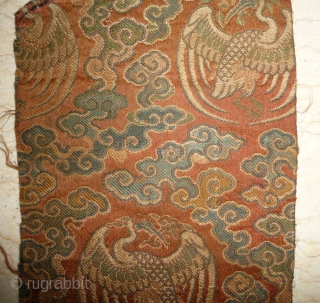 tiny fragment great charisma! silk brocade fragment from the late ming era with crane roundel. strong  imagery refering to long life and immortality according to the daoistic tradition, one row of  ...