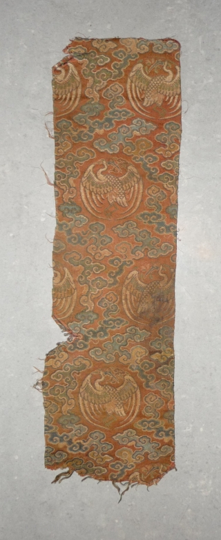 tiny fragment great charisma! silk brocade fragment from the late ming era with crane roundel. strong  imagery refering to long life and immortality according to the daoistic tradition, one row of  ...