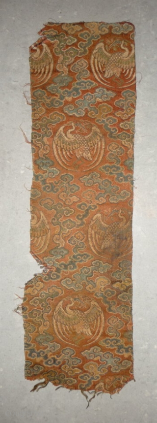 tiny fragment great charisma! silk brocade fragment from the late ming era with crane roundel. strong  imagery refering to long life and immortality according to the daoistic tradition, one row of  ...