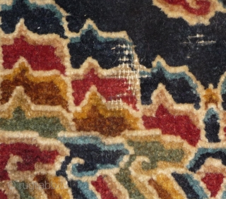 fragment of a rare tibetan saddle rug. it is late 19th century but all colors are natural. the main color is a wonderfull gold yellow. uncommon is its small size, trapezoidal shape  ...