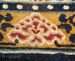 fragment of a rare tibetan saddle rug. it is late 19th century but all colors are natural. the main color is a wonderfull gold yellow. uncommon is its small size, trapezoidal shape  ...