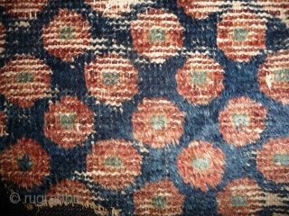 early west china pile fragment with wavy weave and showing the famous central asian pulo design. early rug with this design are rare. some wool weft, approx. 36x 90cm. tiny fragment great  ...