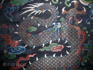 fragment of a 17th century dragon robe. silk brocade with gold threads. china, 62x 68cm                  