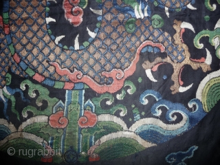 fragment of a 17th century dragon robe. silk brocade with gold threads. china, 62x 68cm                  