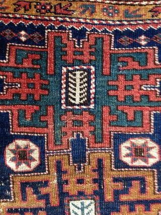 an antique small (115x 84cm) caucasian rug possibly avar with wonderful intense well patinated natural colours. very nicely woven the pile feels like velvet..uncommon main border.. there is no repair except for  ...