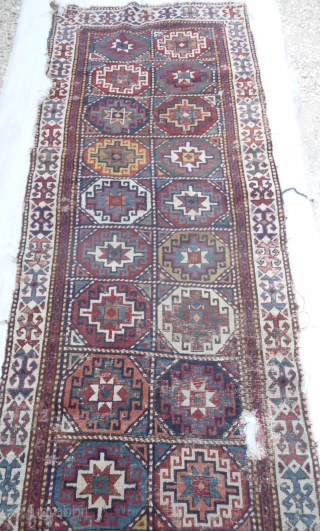 mid 19th c shasavan long rug with rare border and well deep saturated colors, beautiful greens, strong yellow and orange... some camel pile, missing a bit all around and scattered old repiling.  ...