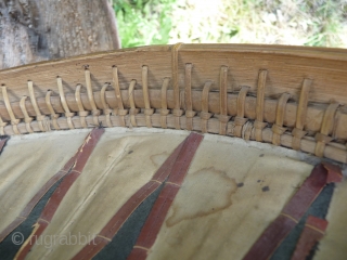 this is a beautiful and rare antique indonesian hat from the south sulawesi. it is made of palm leaves, decorated with pieced cloth and embroidery.the round base is perhaps bambu. please note  ...