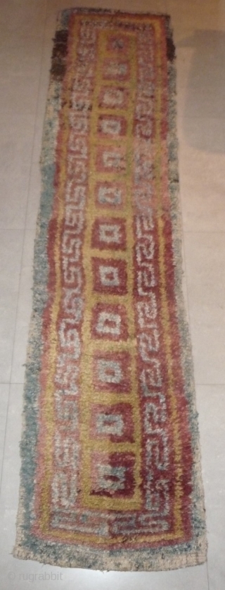 this is a very beautiful early tibetan monastic bench cover warp-faced-back rug with uncommon single row of large squares. it is in very good condition with super natural colors; strong attrativ red,  ...