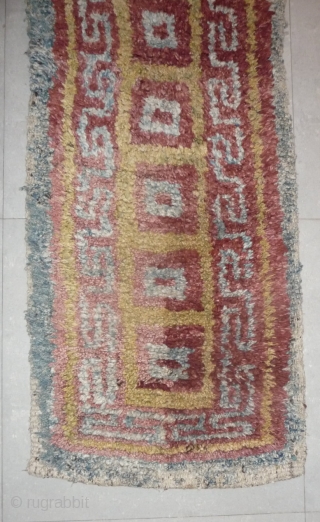 this is a very beautiful early tibetan monastic bench cover warp-faced-back rug with uncommon single row of large squares. it is in very good condition with super natural colors; strong attrativ red,  ...