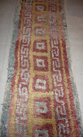 this is a very beautiful early tibetan monastic bench cover warp-faced-back rug with uncommon single row of large squares. it is in very good condition with super natural colors; strong attrativ red,  ...