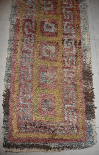 this is a very beautiful early tibetan monastic bench cover warp-faced-back rug with uncommon single row of large squares. it is in very good condition with super natural colors; strong attrativ red,  ...