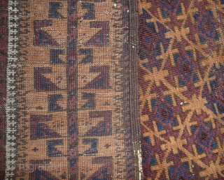 beautiful baluch prayer rug with prayer wear.attrativ hand panel and turkmen field design with a strong reciprocity effect.lots of interesting small amulets. all natural colors with very nice apricot ground color.silk highlights  ...