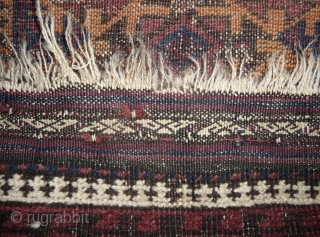 beautiful baluch prayer rug with prayer wear.attrativ hand panel and turkmen field design with a strong reciprocity effect.lots of interesting small amulets. all natural colors with very nice apricot ground color.silk highlights  ...