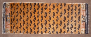 not a tibetan weaving but this small tiger rug was intented for a tibetan monastery to be hung in a door way or as pillar decoration. despite of its late 19thc or  ...