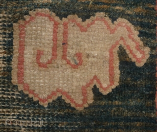 all about clouds. an early 20th century tibetan popart rug with an abrashed green sky background. damage but a funny unique piece; note the integration of a cloud design in the traditional  ...