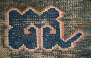 all about clouds. an early 20th century tibetan popart rug with an abrashed green sky background. damage but a funny unique piece; note the integration of a cloud design in the traditional  ...