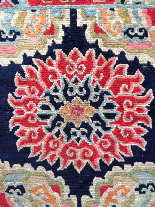 superb tibetan lama seating mat with a bold lotus center. very good condition. first quarter of the 20th century.. rare!             