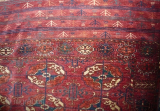 Early tekke main carpet  fragment (cut and shut at top, missing 1 row of guls)with a rare elem, fantastic fine wool and colors including ruby red highlights and very fine weave.  ...