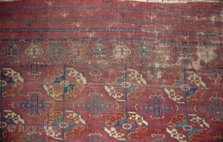 Early tekke main carpet  fragment (cut and shut at top, missing 1 row of guls)with a rare elem, fantastic fine wool and colors including ruby red highlights and very fine weave.  ...