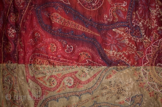 Kashmiri Shawl
SIZE: 75" x 60"
AGE: late 19th century approx.
FROM: Kashmir
NOTE: A primitive Kashmiri shawl, probably made for local use. The ground fabric is a silk/cotton blend (tani). The silk and cotton embroidery  ...