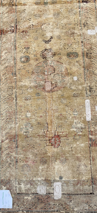 Rare, small  18th c. Yellow gold Khotan rug. 2'-8" x 5'-11". Damaged with old faded repair but still beautiful. Has a "gravitas" that only the best have. Look at the border.  ...