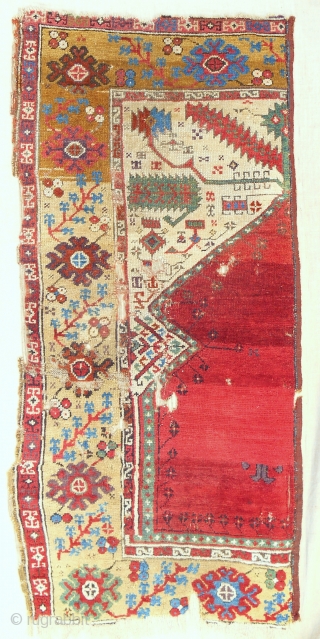 Iconic Sailer unique wide Ladik prayer rug half. Early 18th c. Published in Hali. Conserved and professionally mounted on linen.             