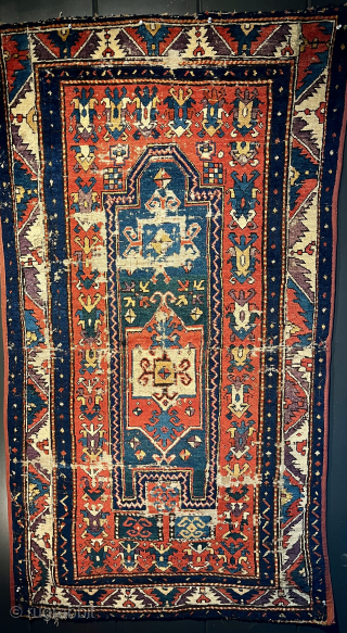 Early Kazak Fachralo prayer rug. Circa 1850. 37" x 69". Extraordinary shimmering color. Good pile with some moth damage. Just professionally washed. Pristine! Email: patrickpouler@gmail.com        