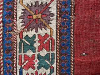 Early Kazak red field complete rug. Circa 1820. About 4 x 9 ft. Clean. Excellent saturated color including a clear, old purple. All original. Decent condition for age. Much better than most. ...