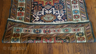 Antique Kuba carpet. Lesghi star design.
The half star is original.  The rug was not cut and spliced.
Uniform medium pile.  Professional repair of pucker in border. 
36 inches wide by 76  ...