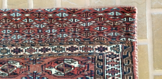 Turkmen Chuval.
Complete with back and remnants of ties.
Yomud??
Good pile on front and the piled band on the back.
Minor wear on red back.
47 inches long by 27 inches wide.
     