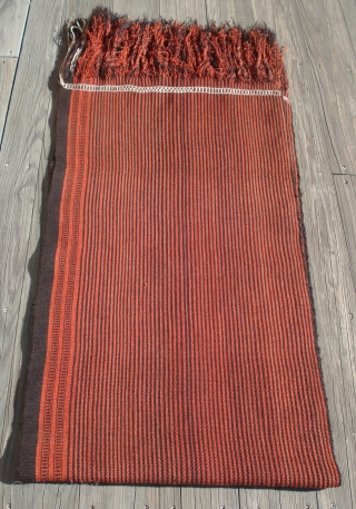 Camel Saddle Blanket or Cover.
Folded and quarter view shown.
Saudi Arabia, Al Hasa, Hofuf.
Completely intact and pristine condition.
All wool construction.
Striking minimalist design.
Finely woven.
Plain weave except for brocaded end bands.
Two  strips 26 inches  ...