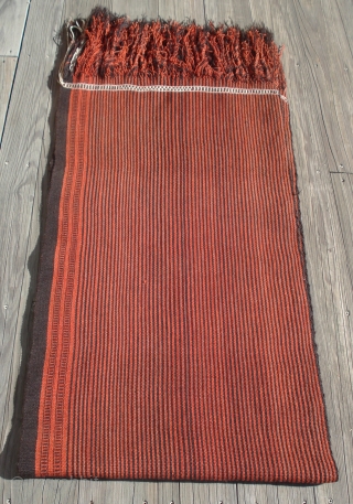 Camel Saddle Blanket or Cover.
Folded and quarter view shown.
Saudi Arabia, Al Hasa, Hofuf.
Completely intact and pristine condition.
All wool construction.
Striking minimalist design.
Finely woven.
Plain weave except for brocaded end bands.
Two  strips 26 inches  ...