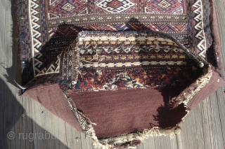 Baluchi Balisht.
Complete except for ties.
Front is undamaged except for usage wear in bottom corners.
Mixed techniques–soumac and warp wrapping.
Goat hair and wool.
38 inches long by 24 inches wide.
      