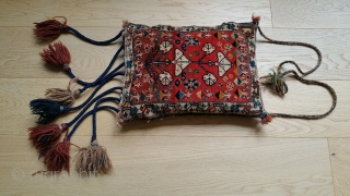 Antique, complete  bag from southwest Persia, possibly Quashgai
Nice braided tassels are a professional restoration done in a Shiraz bazaar workshop
Red field has some abrash
Good design of tree of life and vine  ...