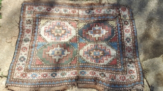 Kazak fragment with Memling guls. As found, dirty, moth-eaten and miserable. Seems to be a cut and shut piece of a larger rug. Thick loose weave and floppy handle.

Fabulous colours though.

120cm x  ...