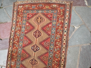 Bakhshayesh long rug, 8' 2" X 3' 3", later 19th century, wool on wool. Heavy wear to foundation limited to central area; sides have good even pile; middle field has low even  ...