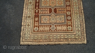 Caucasian Kazak (exact provenance unknown to me, opinions invited). Earlier 20th century, 6' 4" X 3' 6", uncommon earth tone colors and pleasing design. No significant oxidization, scattered small holes, otherwise even  ...