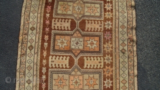 Caucasian Kazak (exact provenance unknown to me, opinions invited). Earlier 20th century, 6' 4" X 3' 6", uncommon earth tone colors and pleasing design. No significant oxidization, scattered small holes, otherwise even  ...