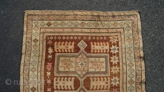 Caucasian Kazak (exact provenance unknown to me, opinions invited). Earlier 20th century, 6' 4" X 3' 6", uncommon earth tone colors and pleasing design. No significant oxidization, scattered small holes, otherwise even  ...