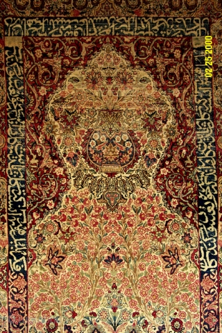 Kermanshah prayer rug from the 4th quarter of the 19th century with
cartouche and inscribed boders. Wide variety of natural colors and
refined execution of vase design. (i.e. Dimensions 4'8" X 7'0")   