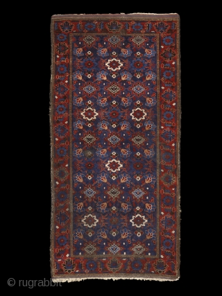 "Why should I be unhappy? Every parcel of my being is in full bloom." Rumi, 13th century, Baluch rug, Ferdows area, North-east Persia, 19th century. Wool on cotton with goat hair side  ...