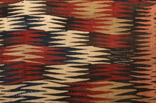 Veramin/Varamin Kilim, 110x224cm, end of the 19th century.
Beautiful vegetable dyed colors combined with natural light-brown coloured wool.
Wool on wool. Very archaic look, dazzling design, early type of Vermain kilims, real tribal piece.
Embroidered  ...