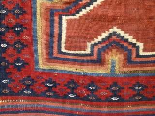 Afshar kilim, 2nd half of 19th century, 180X115cm. 3 rythmical diamonds on a brick-red ground, sorrounded by eye dazzler, rainbow-like saf-bordure. The main field repose the eyes between the vibtaring, multiple borders.  ...