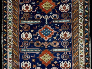 Well balanced Perepedil rug with unusual symbols/motifs. Note the whie palmettes with double headed birds (?) and the 'exploding'flowers throughout the central spine of the rug.  Fully asymmethrically rendered animals and  ...