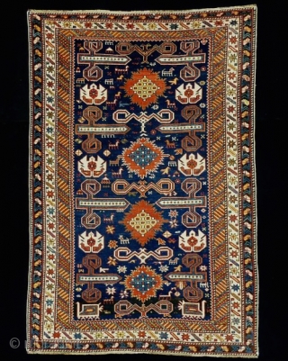 Well balanced Perepedil rug with unusual symbols/motifs. Note the whie palmettes with double headed birds (?) and the 'exploding'flowers throughout the central spine of the rug.  Fully asymmethrically rendered animals and  ...